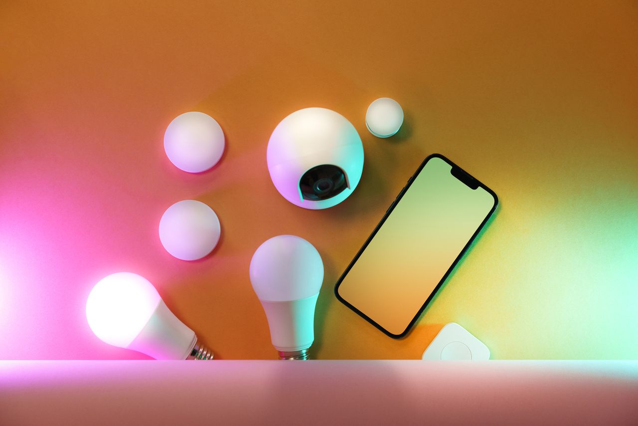 Crafting Captivating Headlines: Your awesome post title goes here A collection of smart home devices including light bulbs and a smartphone, showcasing modern technology.